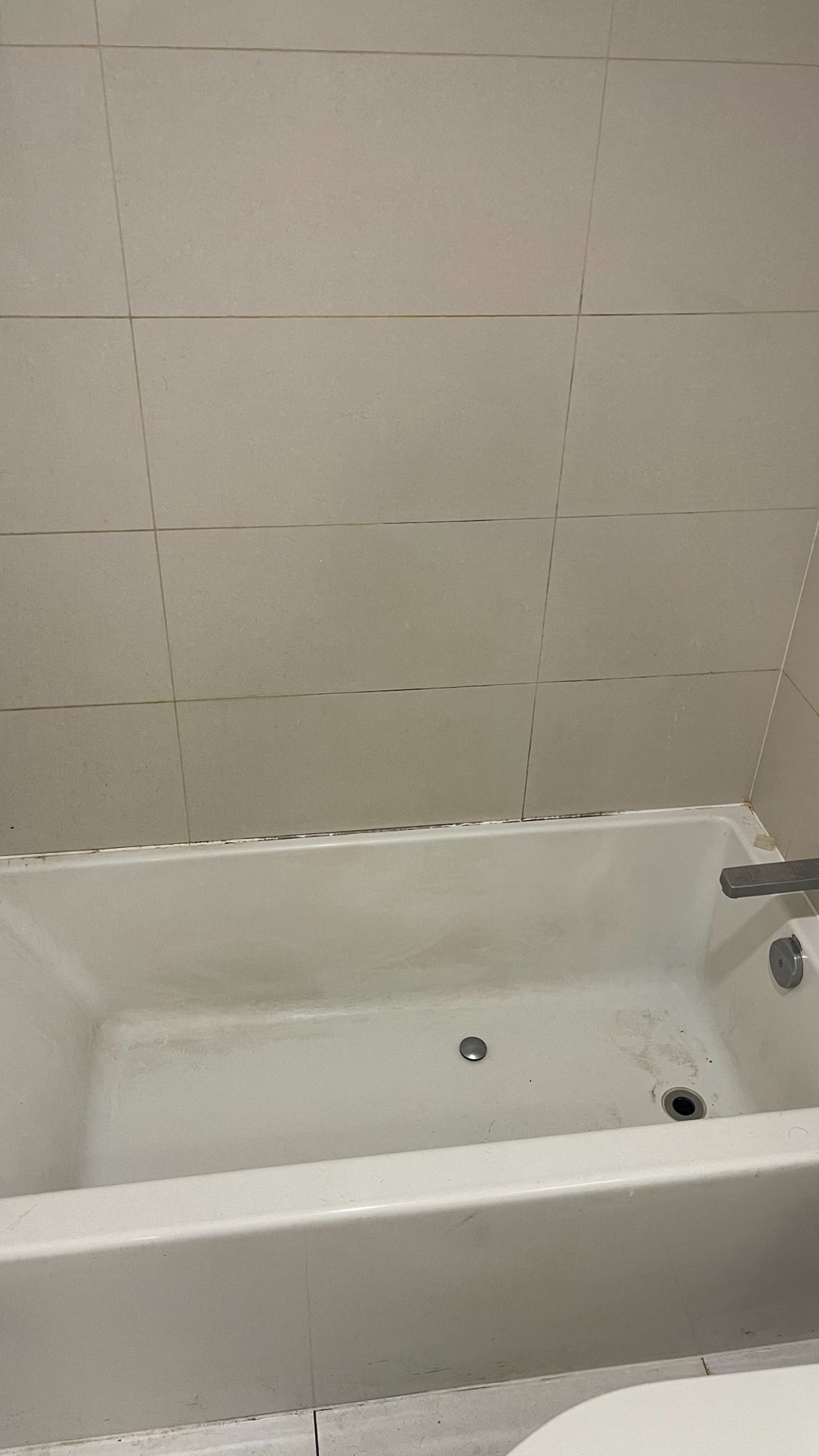 Bathtub before LV Zee deep cleaning service